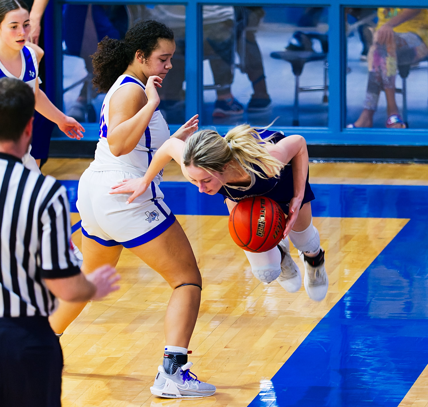 Ashley Davis successfully uses the boundary to force a turnover. [see more shots, buy basketball photos]